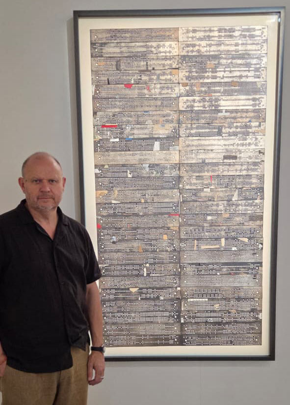 Artist-Stuart-Robertson-with-his-art-The-Braille-Teacher