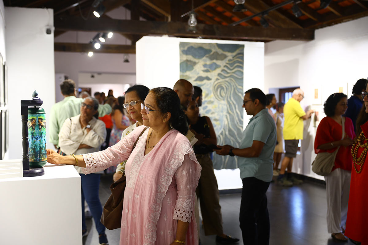 Visitors-flock-to-the-Aguad-Port-&-Jail-Complex,-engaging-with-artworks